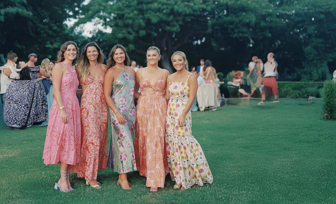 Attractive brunette girl in pink dress.